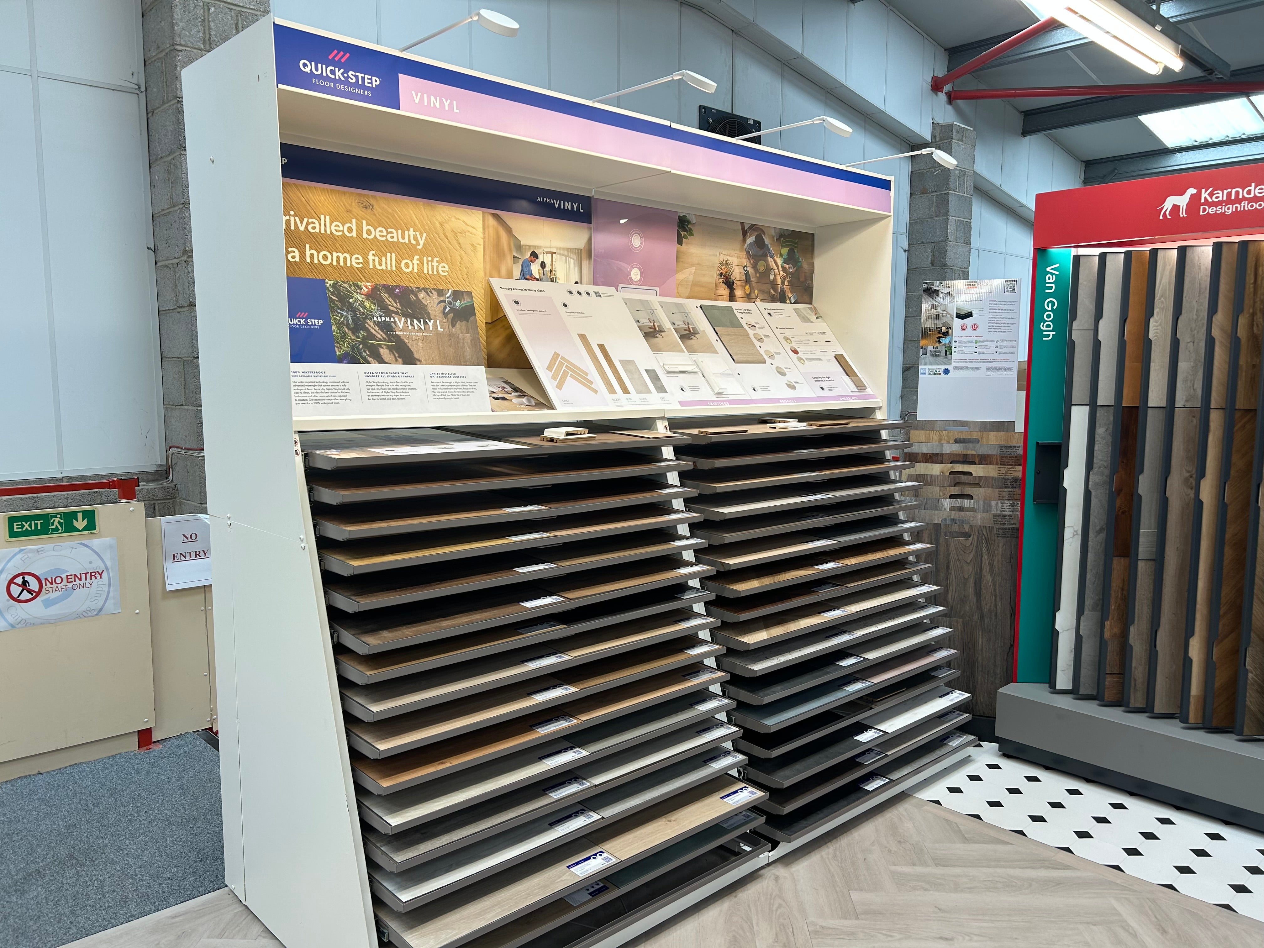 Display of Quick-Step flooring samples in a showroom setting